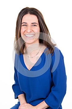 Pretty beautiful cheerfull slim smiling happy businesswoman sit in blue dress over white background photo