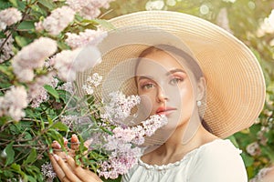 Pretty beautiful woman with flowers outdoors