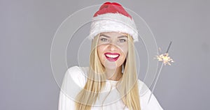 Pretty blond girl enjoy chrismas with sparkler