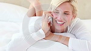 Pretty blond woman phoning