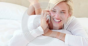 Pretty blond woman phoning