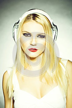 Pretty blonde dg girl in headset with red lips