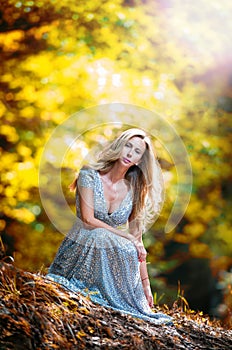 Pretty blonde fairy lady with white dress