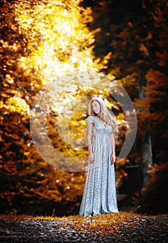 Pretty blonde fairy lady with white dress