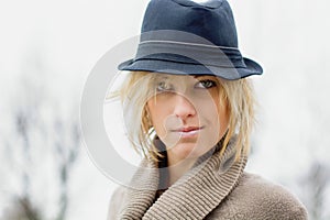 Pretty blonde girl with fedora hat