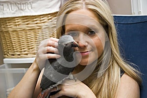 Woman and Her Pet African Grey Parrot