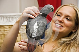 Woman and Her Pet African Grey Parrot