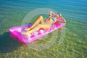 Pretty blonde on inflatable raft