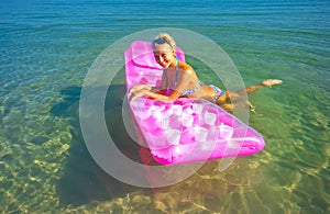 Pretty blonde on inflatable raft
