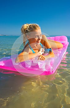 Pretty blonde on inflatable raft