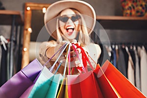 Pretty Blonde Shopaholic Holding Many Colorful Shopping Bags