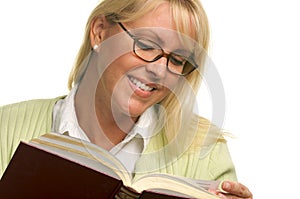 Pretty Blonde Smiles While Reading a Book