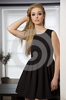Pretty blonde woman in elegance fashionable dress