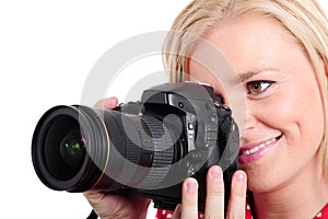 Pretty blonde woman photographer with her camera, on white