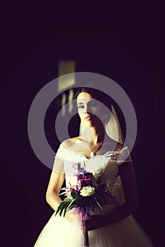 Pretty bride with flower bouquet