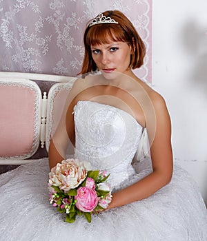 Pretty bride posing in wedding dress