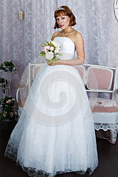 Pretty bride posing in wedding dress