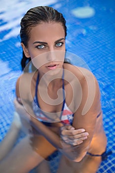 Pretty brunette in a bright swimsuit