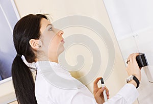 Pretty brunette girl cleaning whiteboard