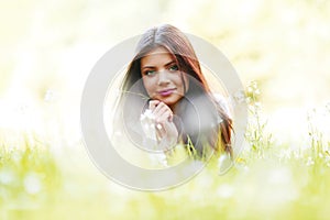 Pretty brunette girl laying on grass