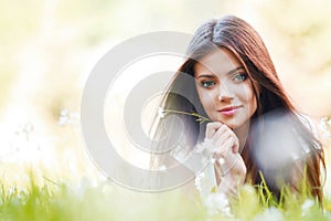 Pretty brunette girl laying on grass