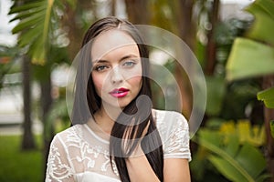 Pretty brunette hippie looking at camera