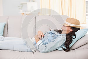 Pretty brunette relaxing on the couch