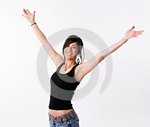 Pretty Brunette Woman Holds Arms Outstretched Jubilant Looking Up photo