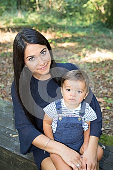 Pretty brunette young woman with long hairs with cute son child boy