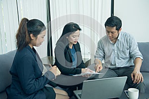 Pretty business interns listening to their team leader