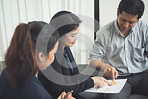 Pretty business interns listening to their team leader.