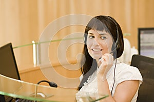 Pretty business woman with headset