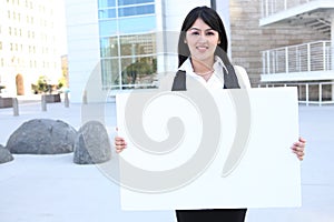 Pretty Business Woman Holding Sign