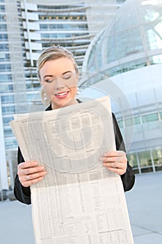 Pretty Business Woman Reading Newspaper