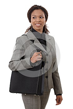 Pretty businesswoman going to work smiling