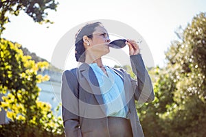 Pretty businesswoman having a glass of wine