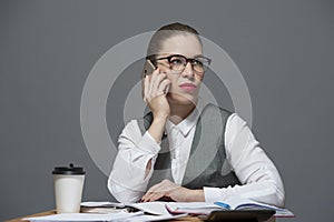 Pretty businesswoman pouting making a call