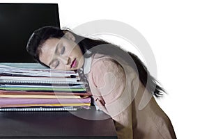 Pretty businesswoman sleeps above documents