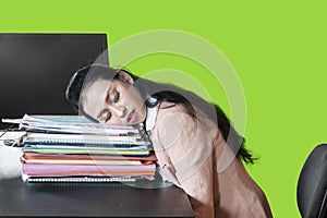 Pretty businesswoman sleeps on document heap