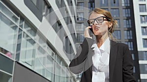 Pretty businesswoman talking on phone angrily