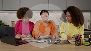 Pretty busy African American women freelancer working on business project