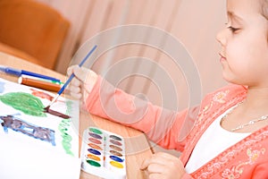 Pretty caucasian child watercolor paint