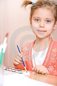 Pretty caucasian child watercolor paint