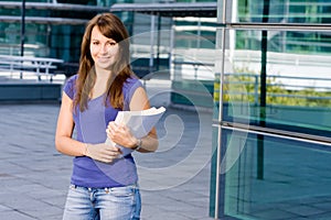 Pretty caucasian girl standing in school