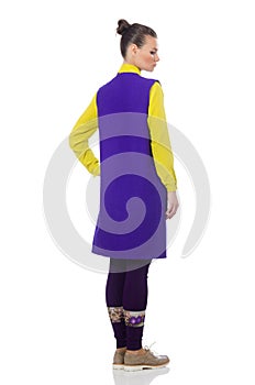 The pretty caucasian model in purple vest isolated on white