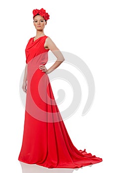 Pretty caucasian model in red long evening dress isolated on whi