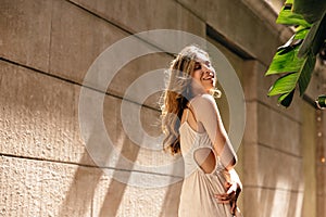 Pretty caucasian young lady enjoys spending time outdoors in summer.