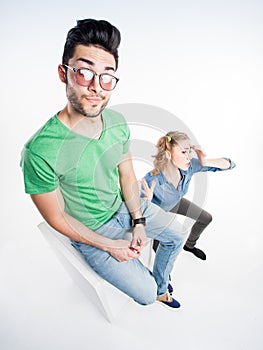 Pretty couple dressed casual arguing - wide angle shot