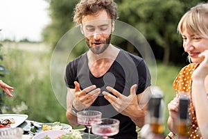 Pretty couple have fun at lunch outdoors