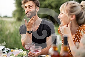 Pretty couple have fun at lunch outdoors